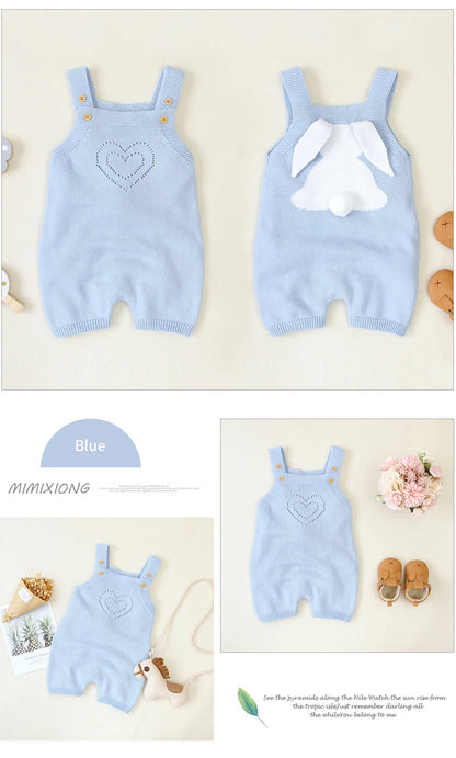 Light blue baby romper with heart design on a white background