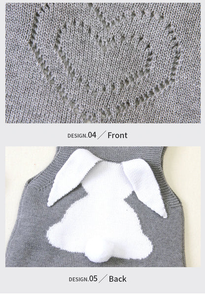 Gray knitted garment with white bunny ears on a white background